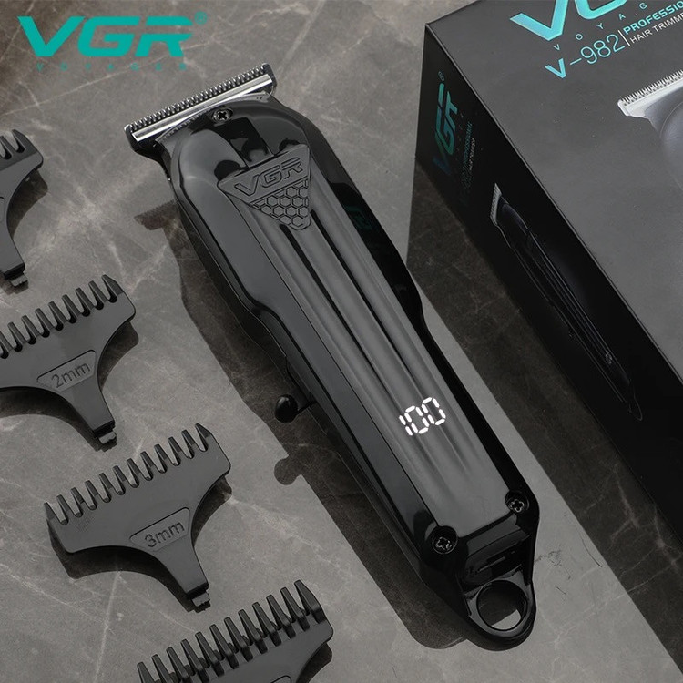 ماشین اصلاح موی سر و صورت وی جی ار مدل V-982 با تیغه استیل پیشرفته، منبع انرژی باتری، مدت زمان استفاده 120 دقیقه، مدت زمان شارژ 120 دقیقه، همراه با کابل شارژ USB، شانه و دفترچه راهنما